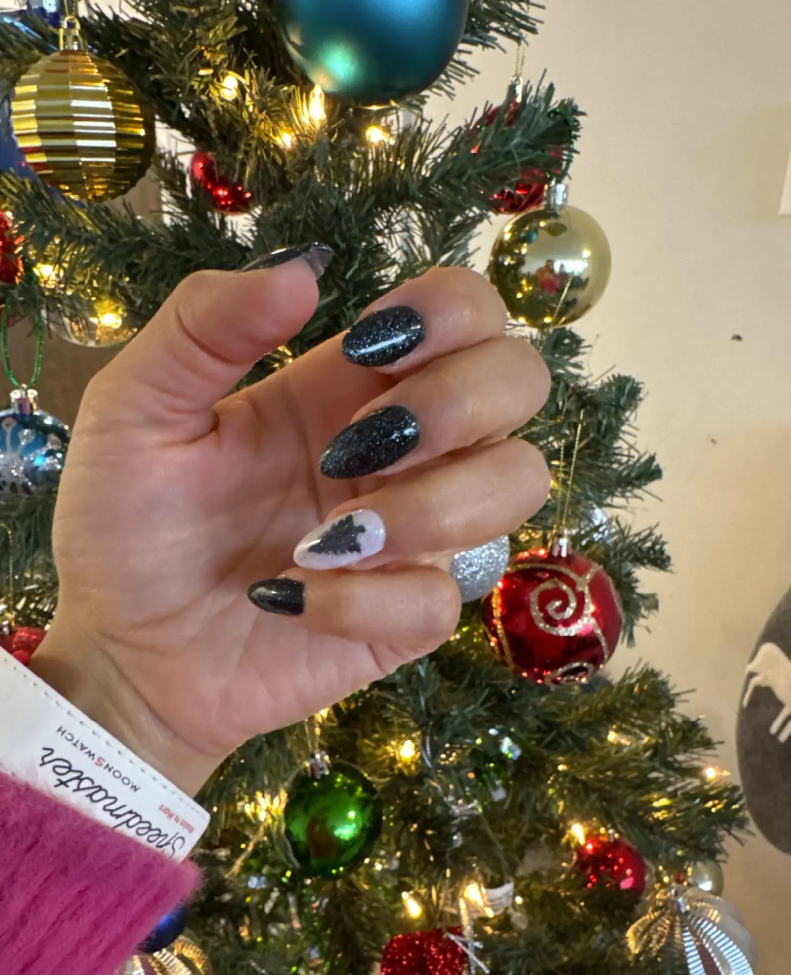Black glitter holiday nails with tree art